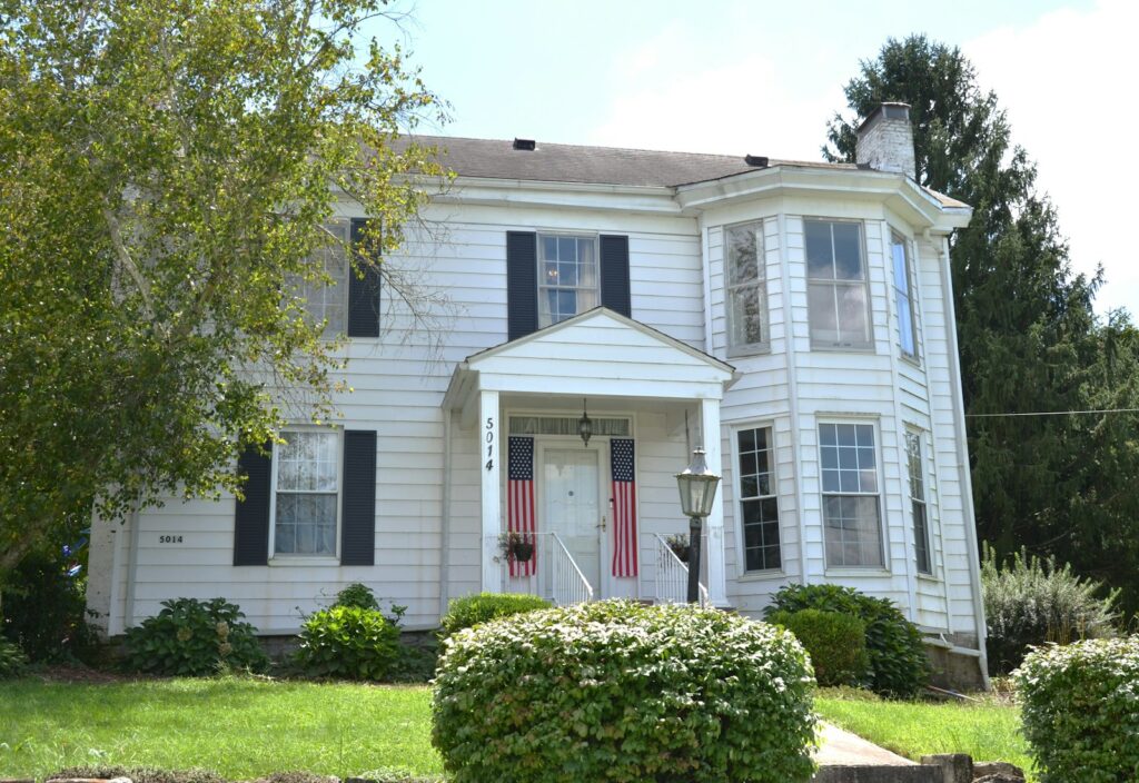 White colonial home with double-hung replacement windows